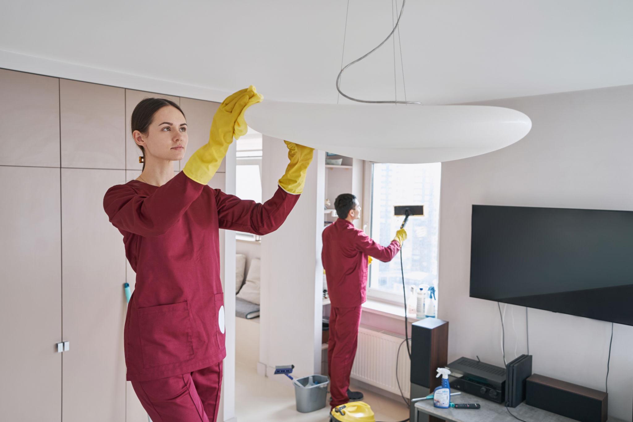 Two cleaning workers doing their in a residential house