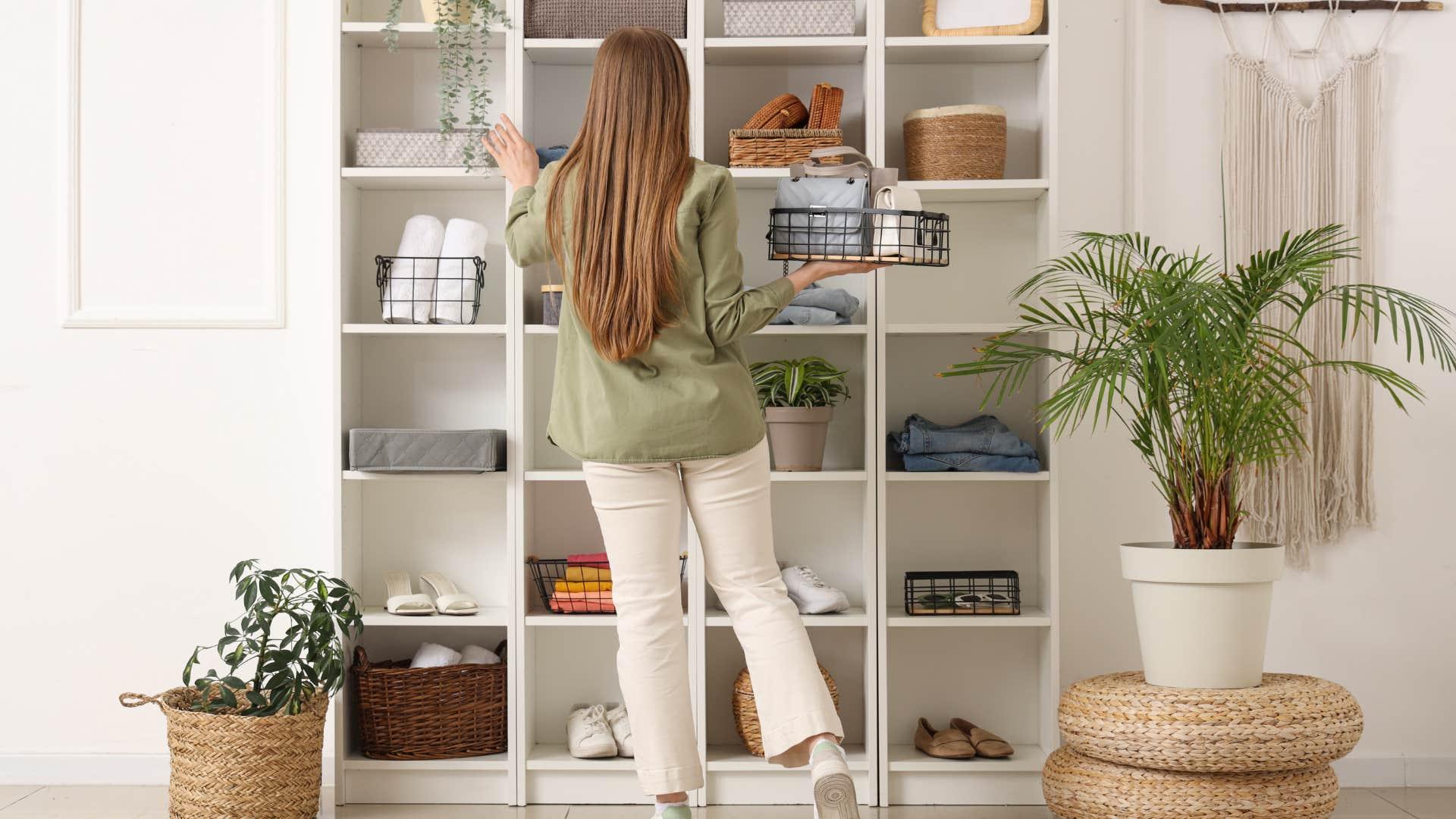 Woman decluttering and arranging some of her things